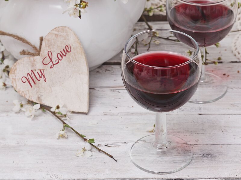 Red wine glasses with heart sign