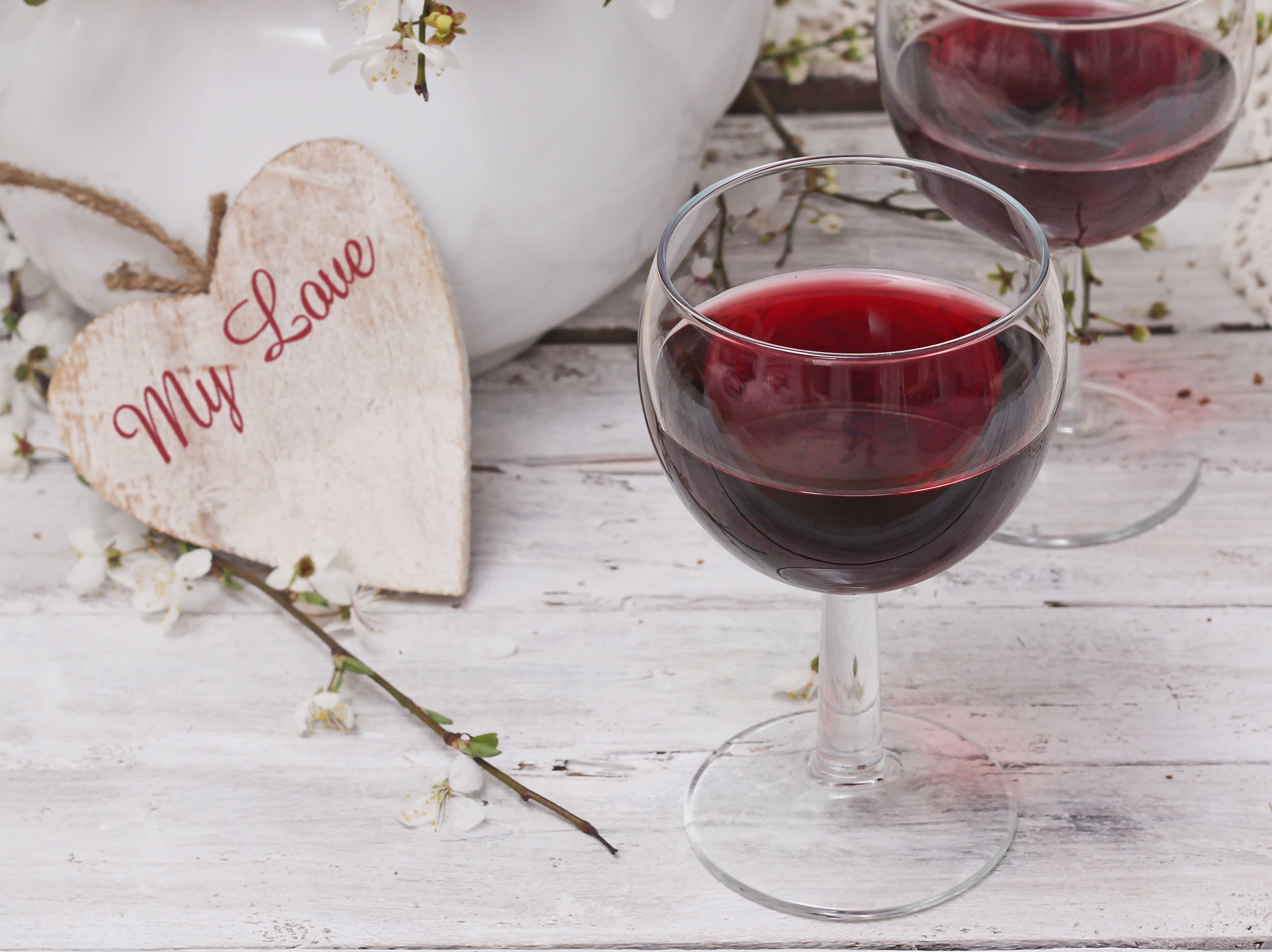 Red wine glasses with heart sign
