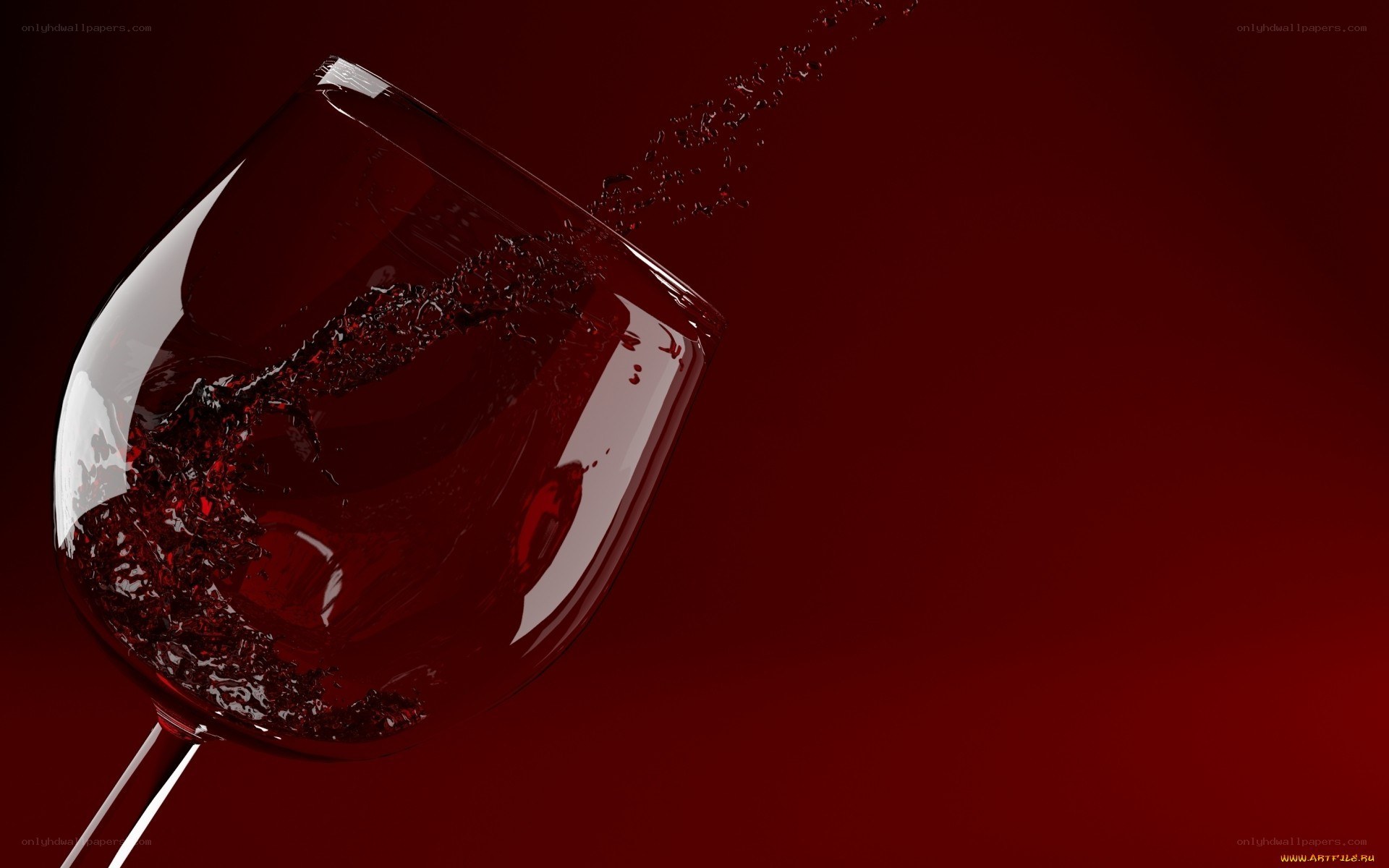 Red wine splashing in glass