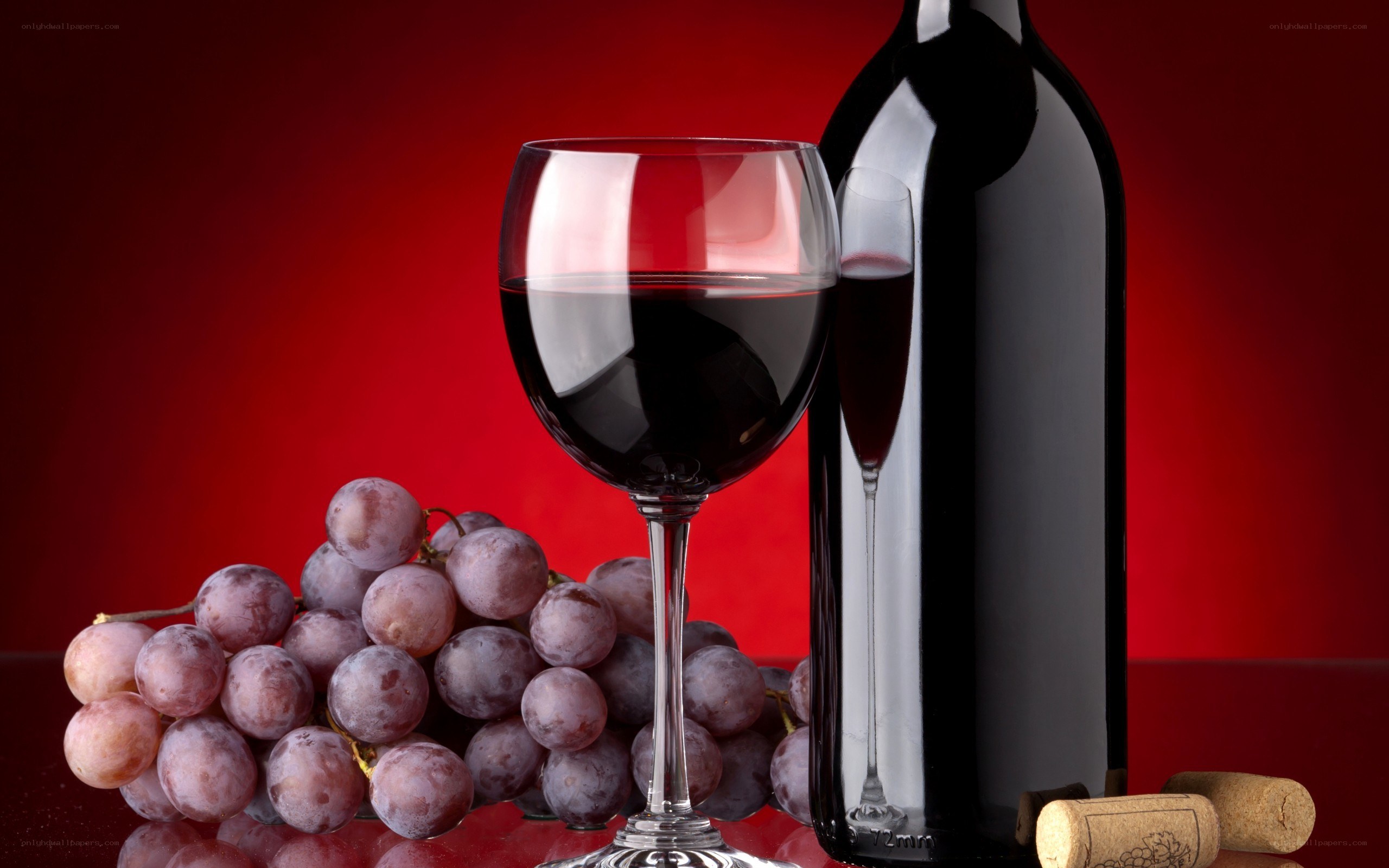 Red wine with grapes and bottle