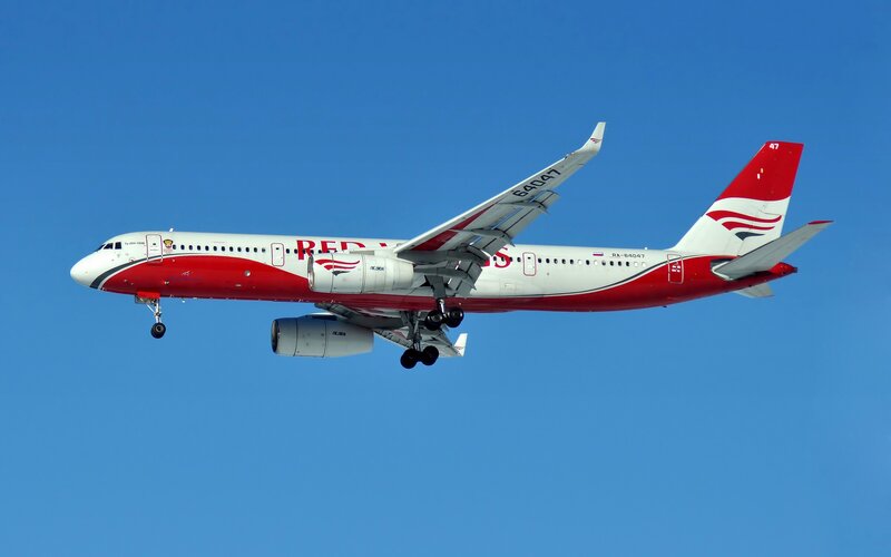 Red Wings Airplane in Flight