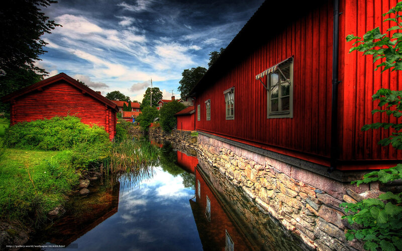 Red Wooden Houses by Canal