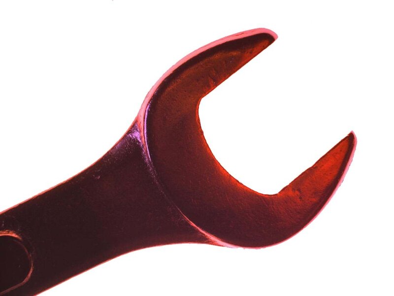 red wrench on white background
