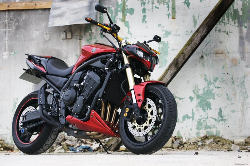 Red Yamaha motorcycle in urban setting