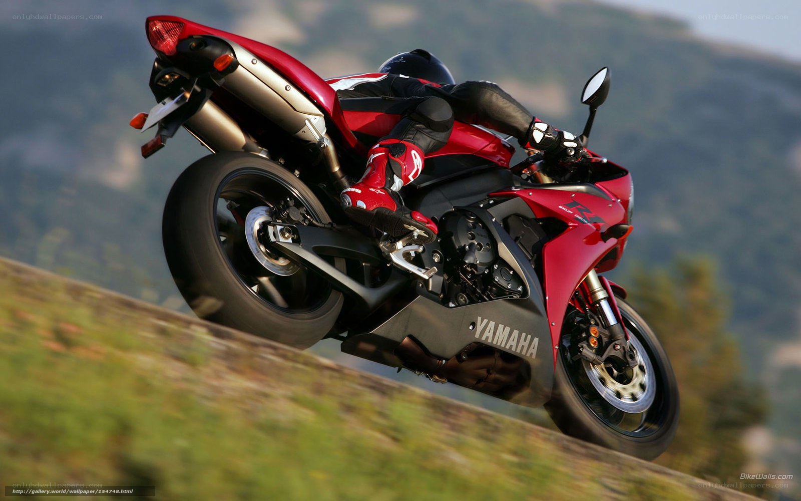 Red Yamaha motorcycle on a hill