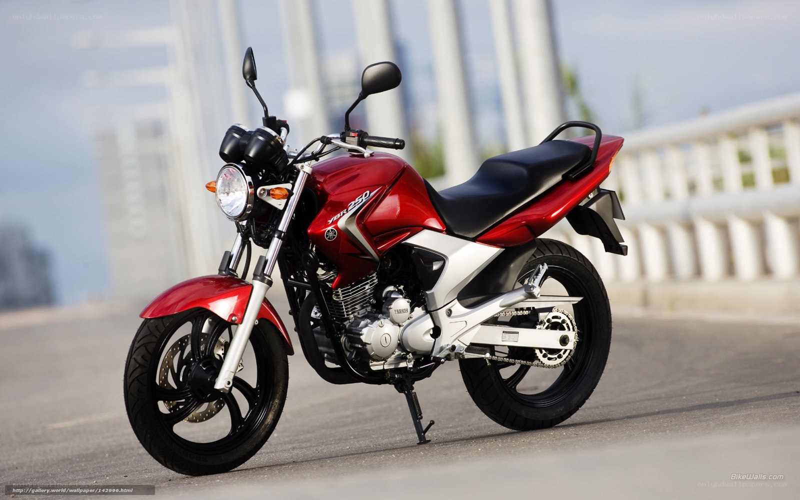 Red Yamaha motorcycle on bridge