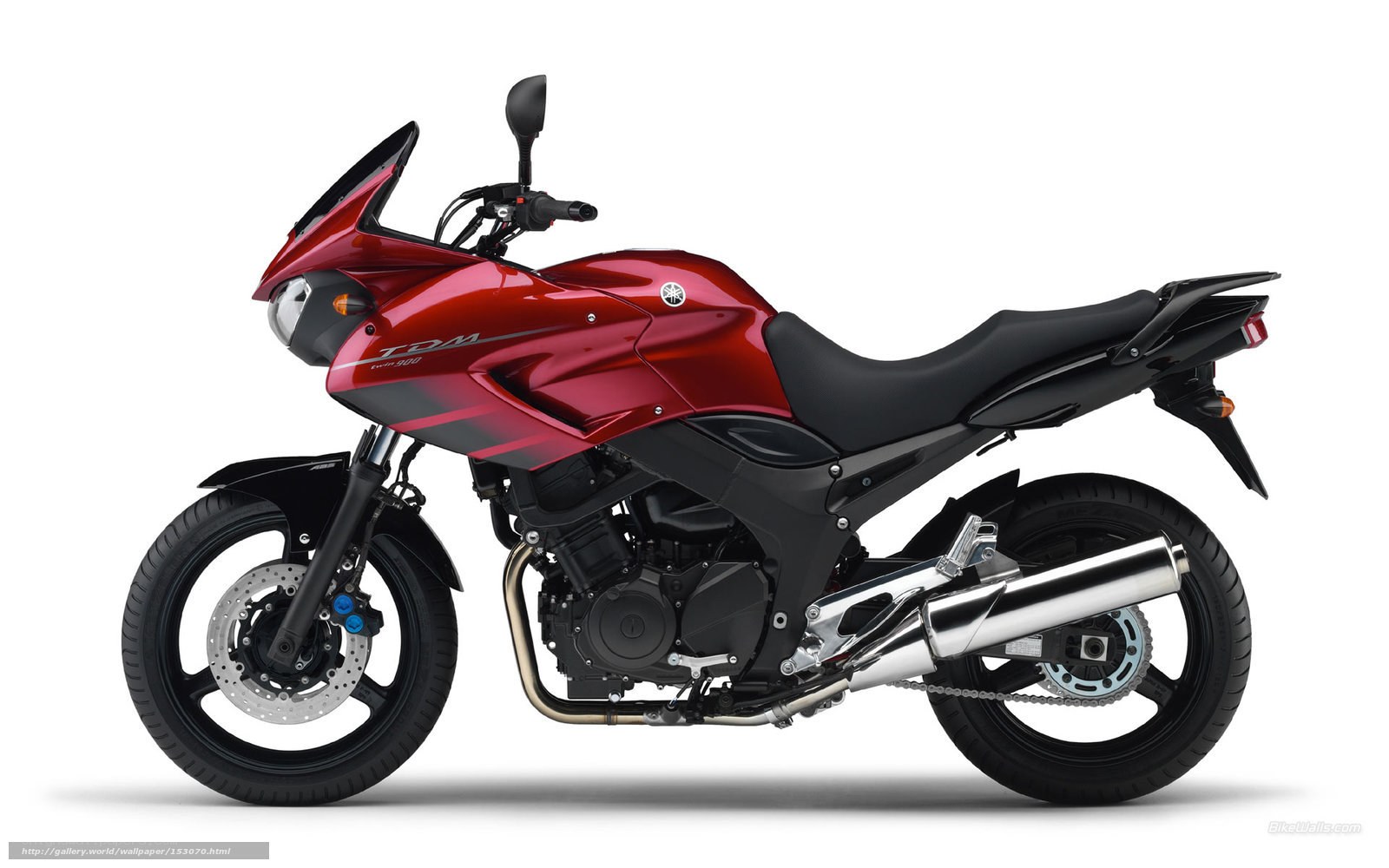 red yamaha tdm motorcycle