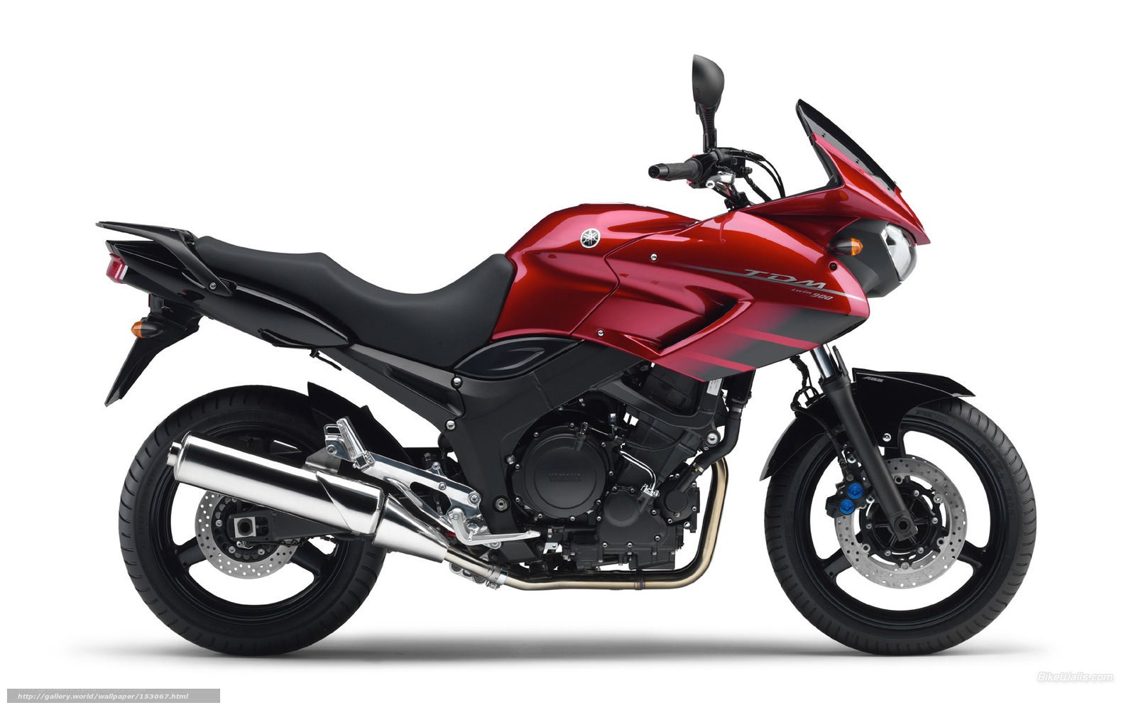 red yamaha tdm motorcycle