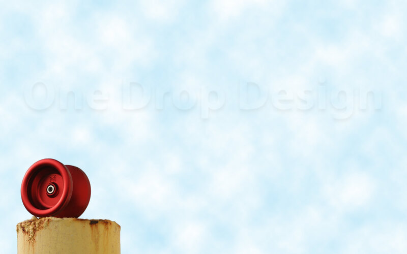Red yoyo on a post
