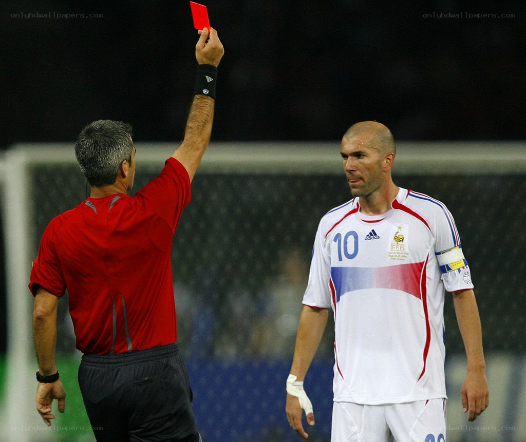 Referee shows red card to player