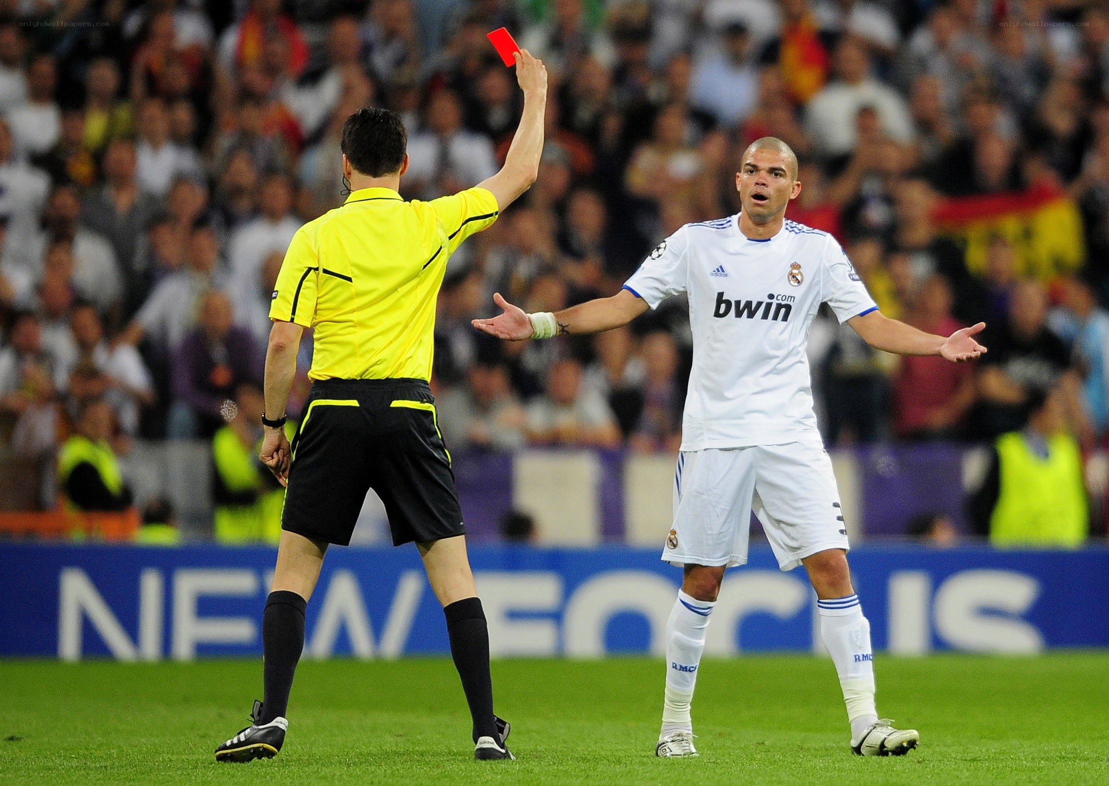Referee shows red card to player