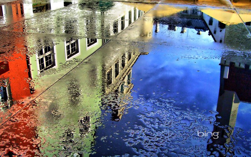 Reflected Buildings in Puddle