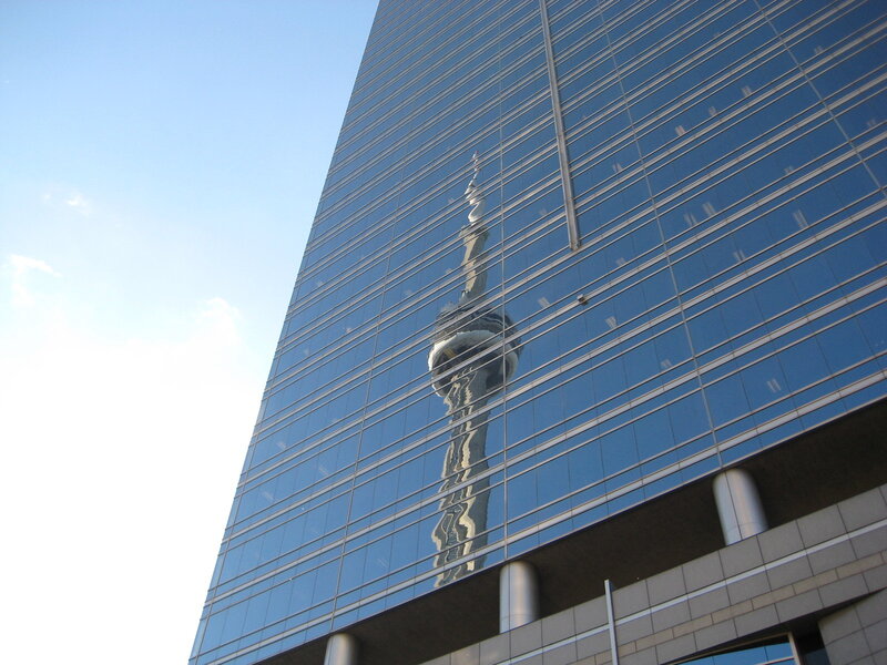 Reflection of a tower in glass