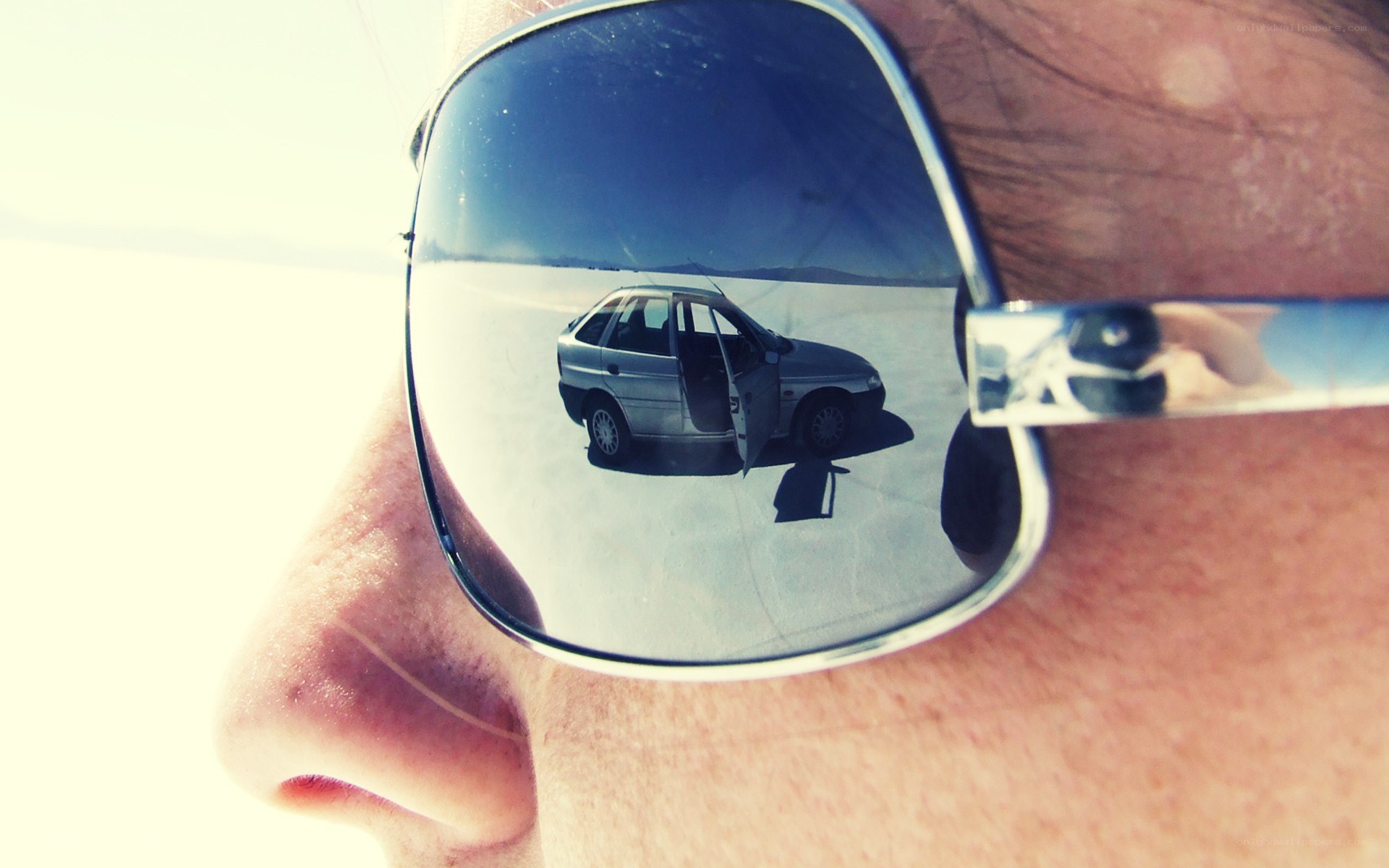 reflection of car in sunglasses