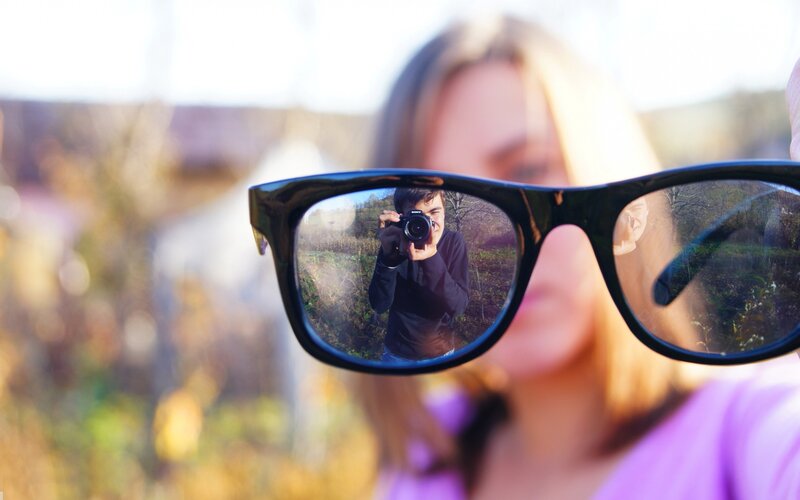 Reflection of Man in Glasses
