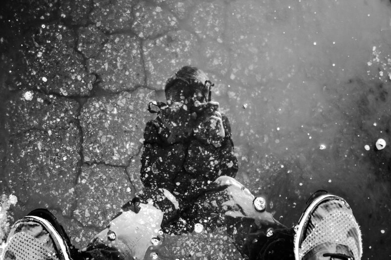 Reflection of Person in Puddle — Black