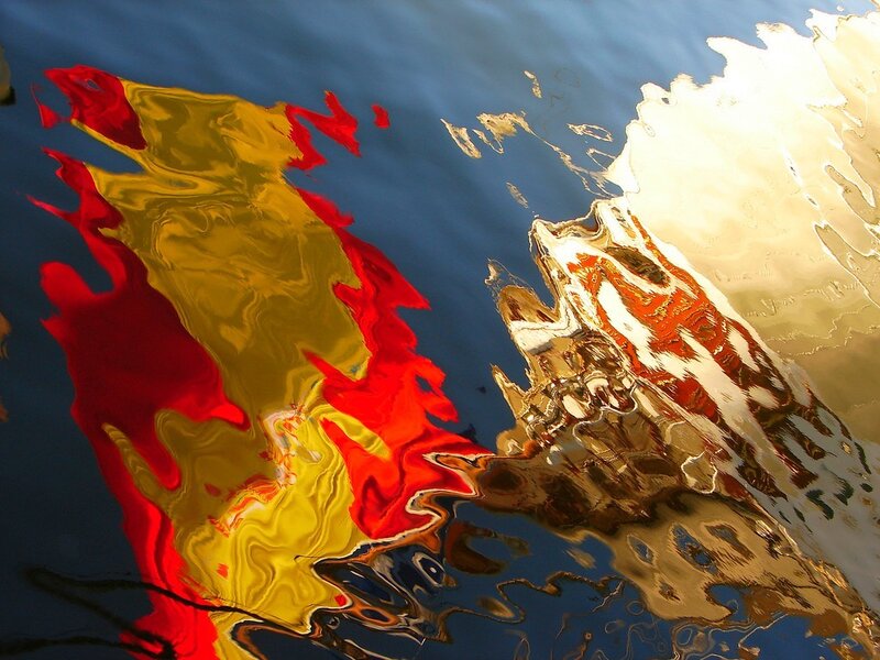 Reflection of Spanish flag in water