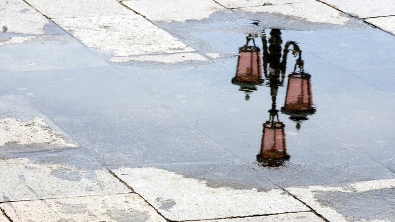Reflection of street lamps in a puddle