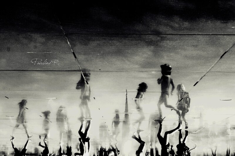 Reflections of people walking