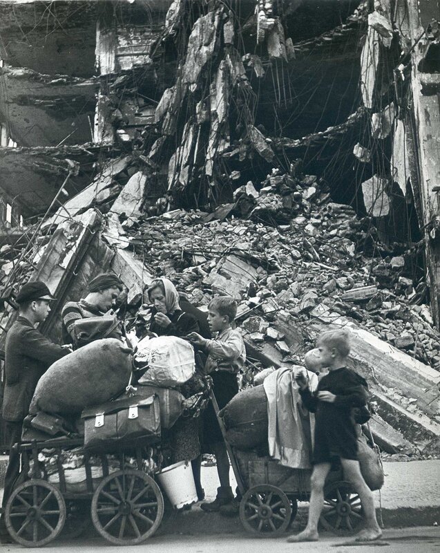 Refugees with belongings after bombing