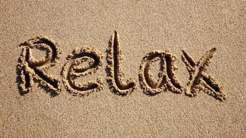 relax written in sand