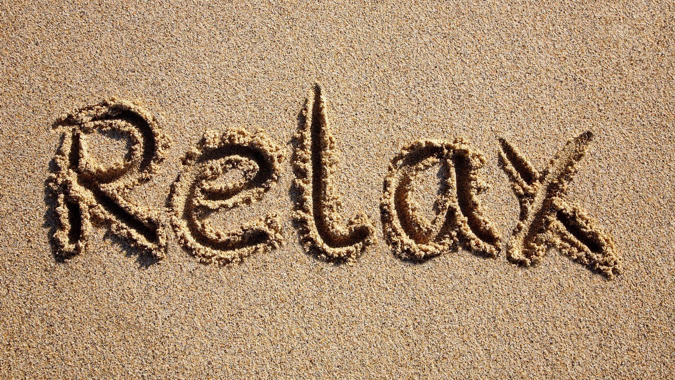 relax written in sand