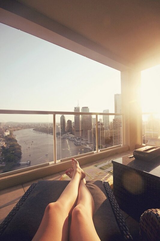 Relaxing on a balcony with city view