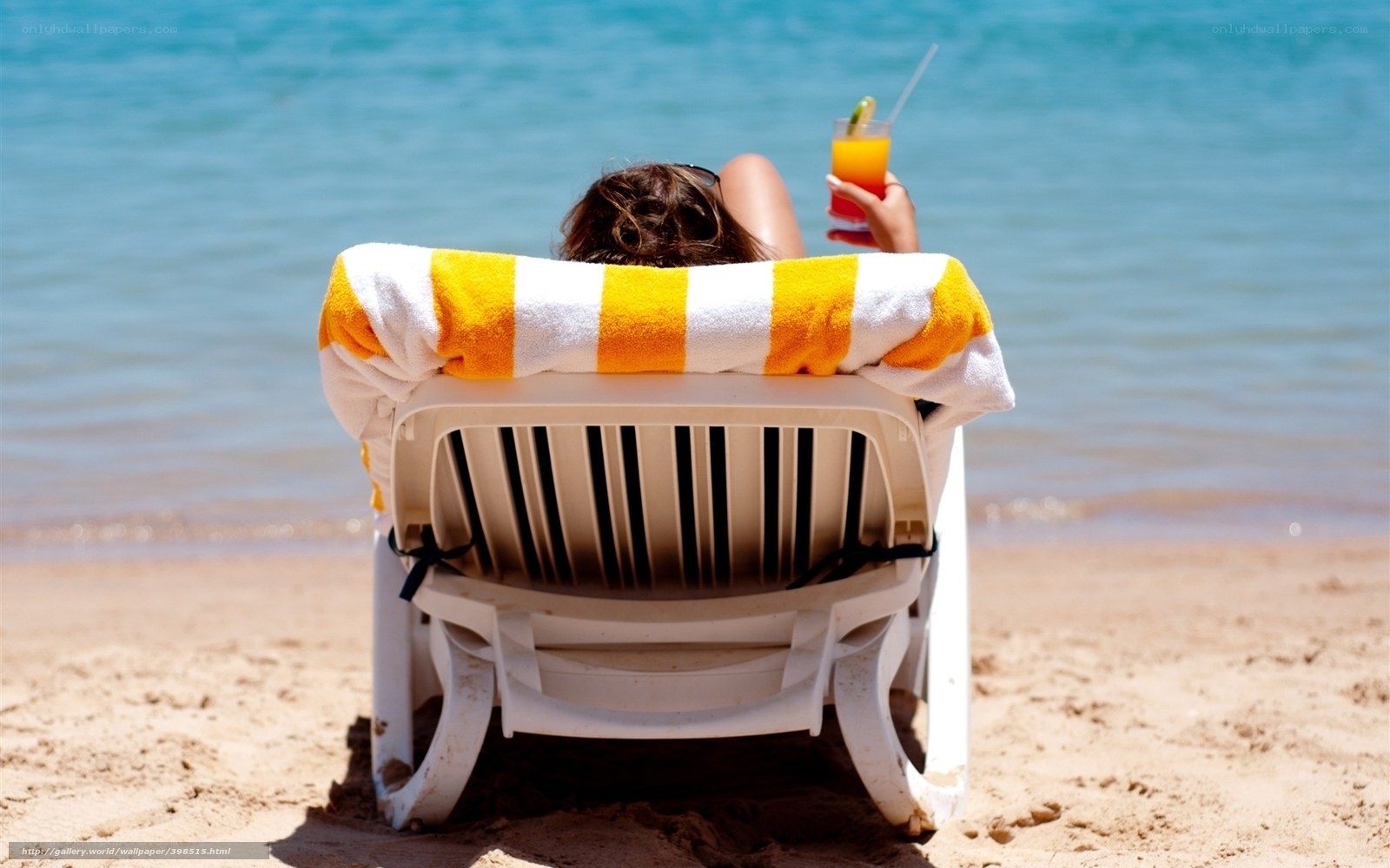 Relaxing on the beach with a drink