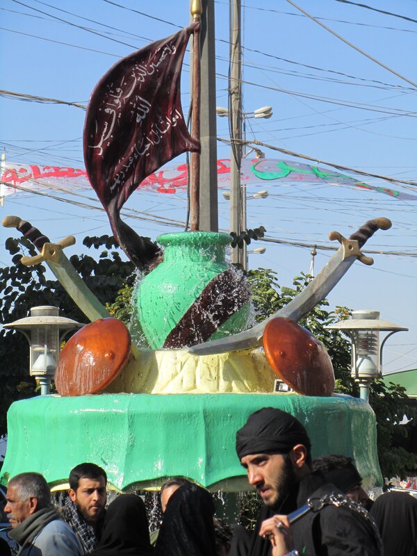Religious float with swords and flag