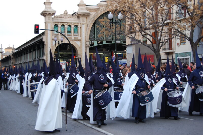 Religious procession with hooded figures