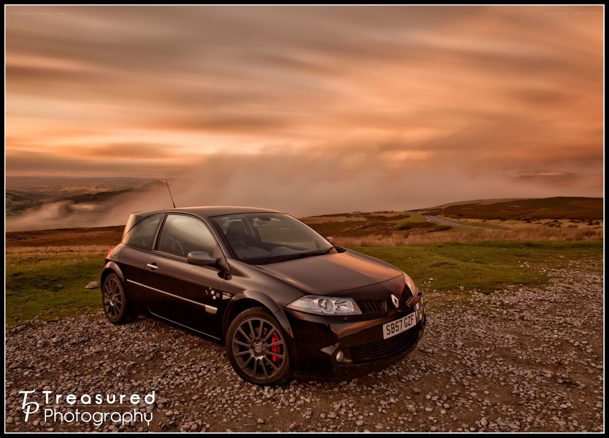 Renault Clio on a hill at sunset