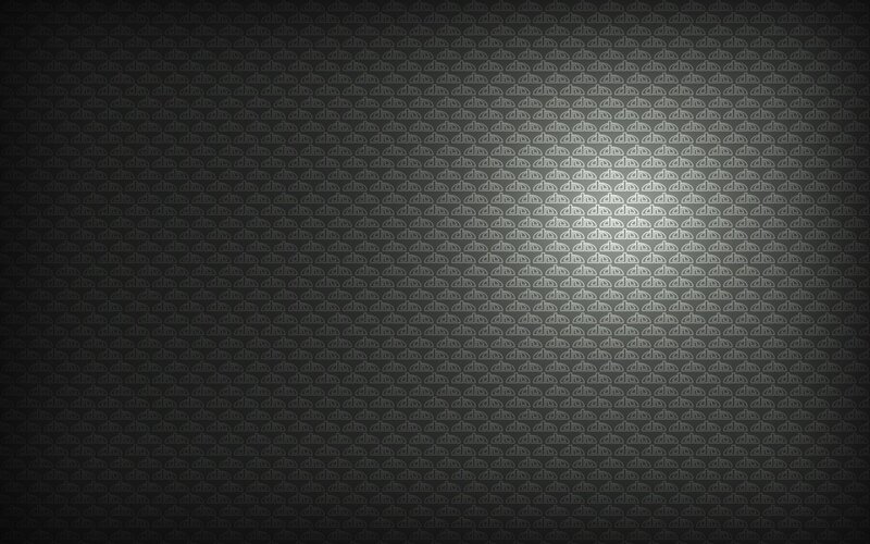 Repeating Pattern on Dark Surface