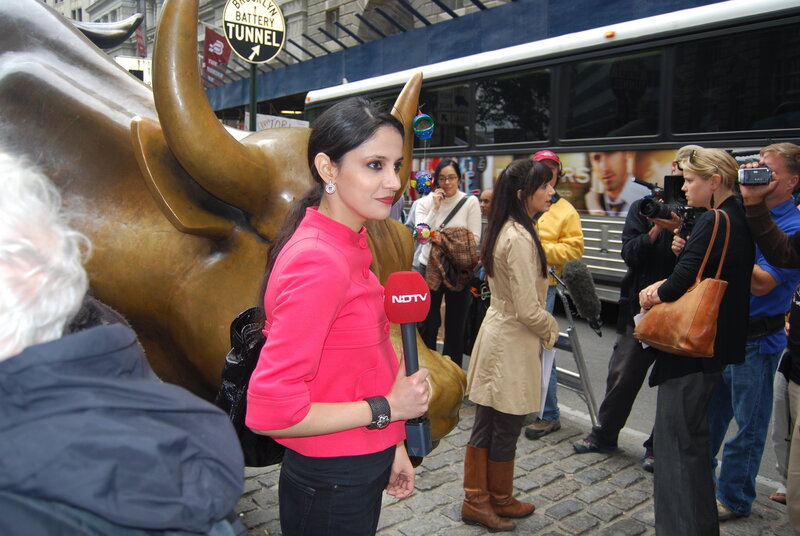 Reporter at Charging Bull statue