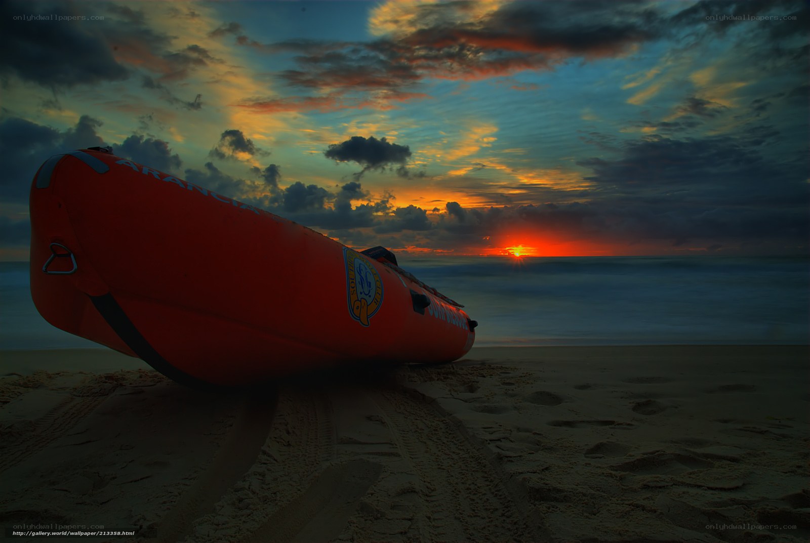 Rescue boat on beach at sunset