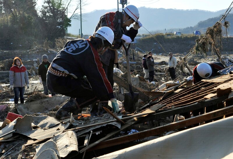 Rescue Workers at Disaster Site — Brown