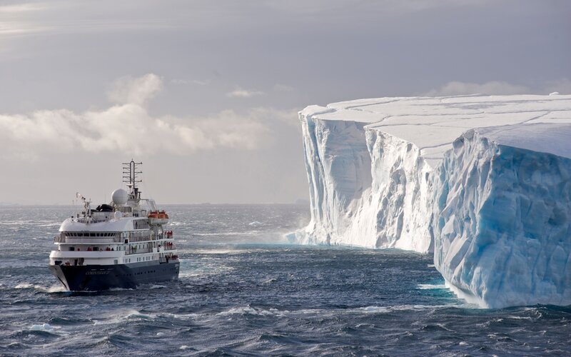 Research Vessel Near Iceberg