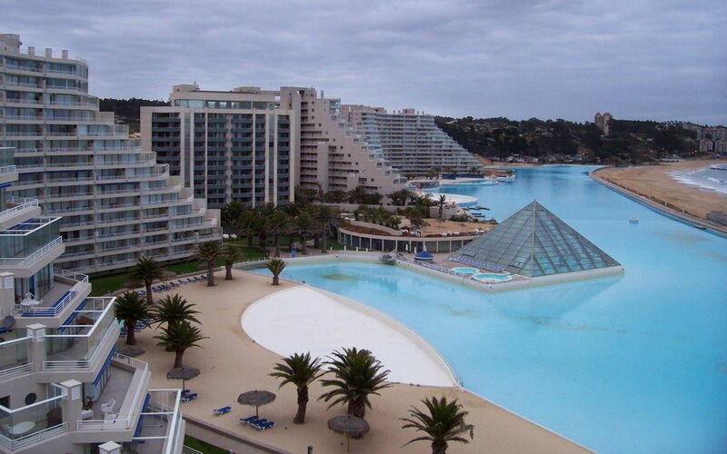 resort with large pool and pyramid