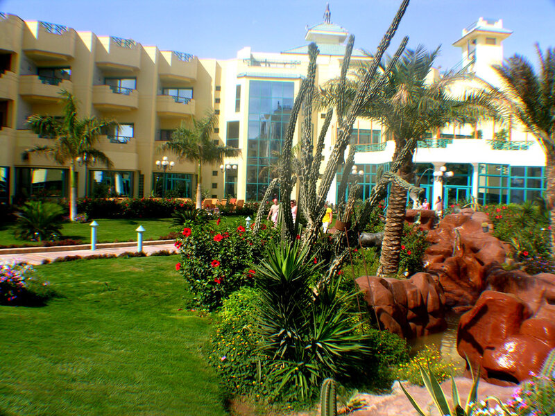 Resort with palm trees and gardens