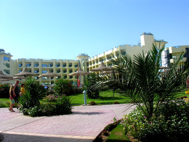 Resort with palm trees and umbrellas