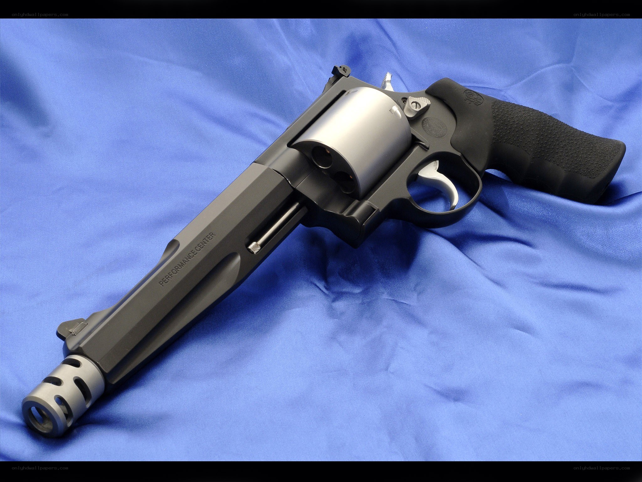 revolver on blue cloth