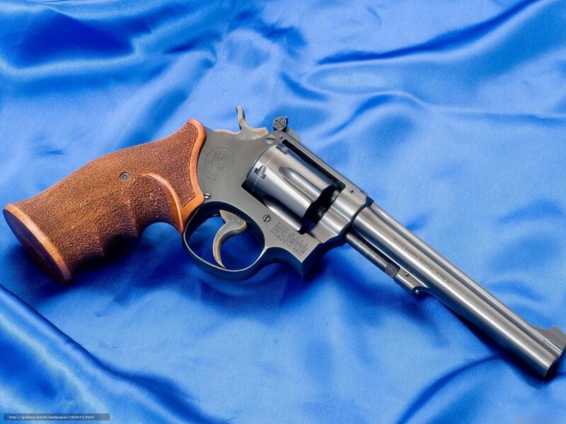 revolver on blue cloth