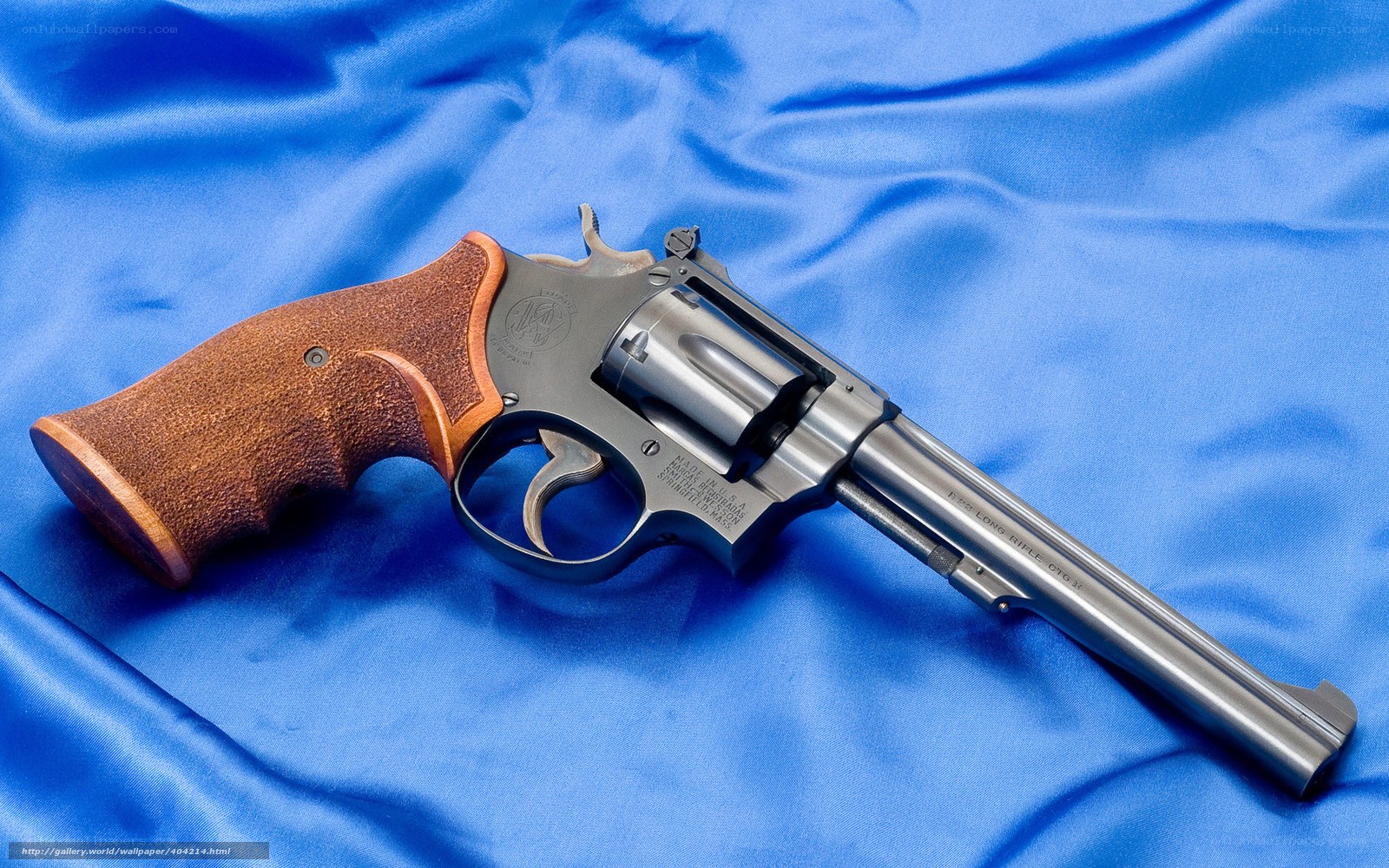 revolver on blue cloth