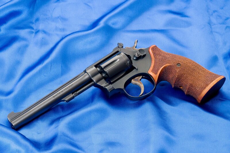 revolver on blue cloth