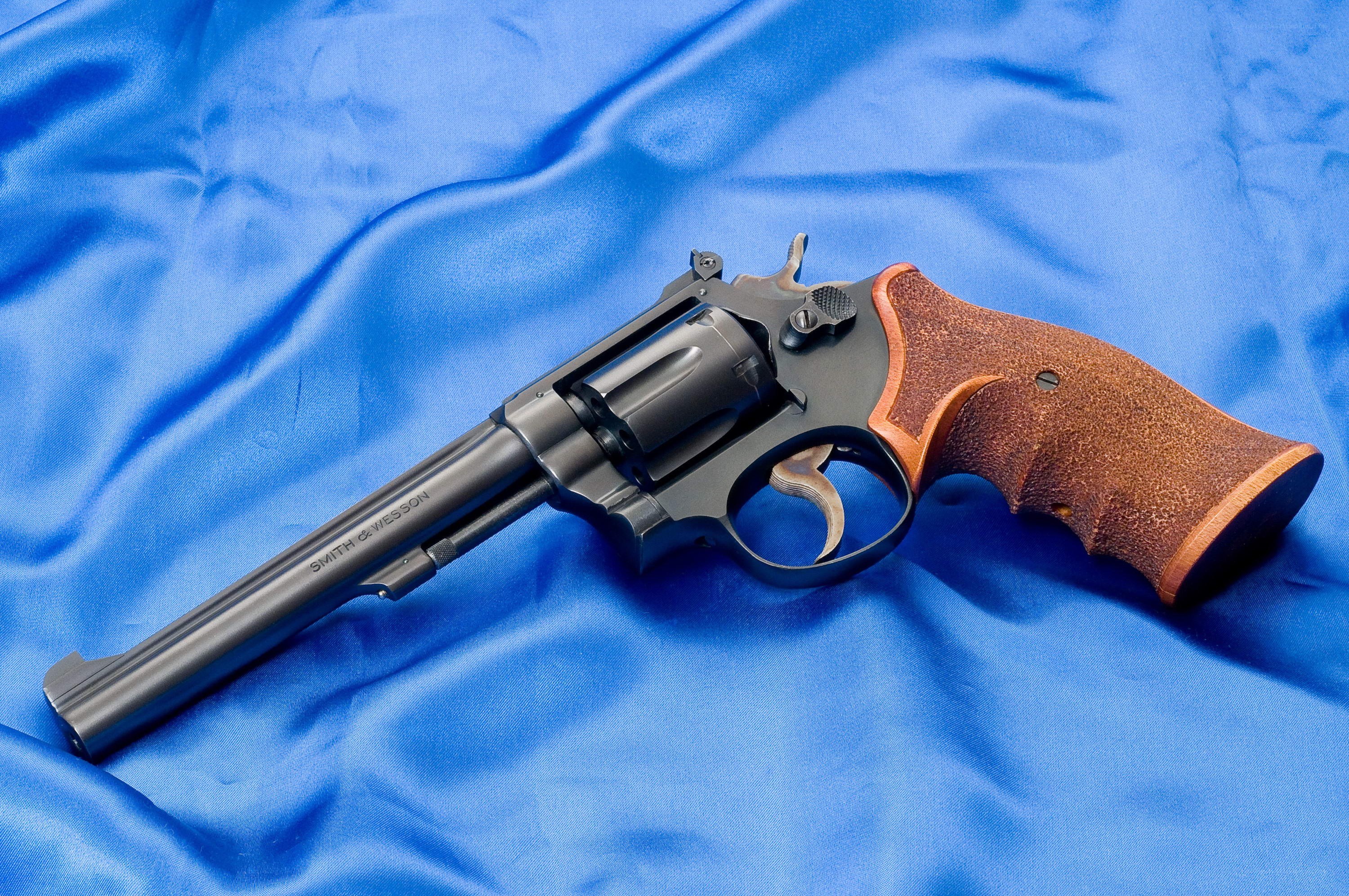 revolver on blue cloth
