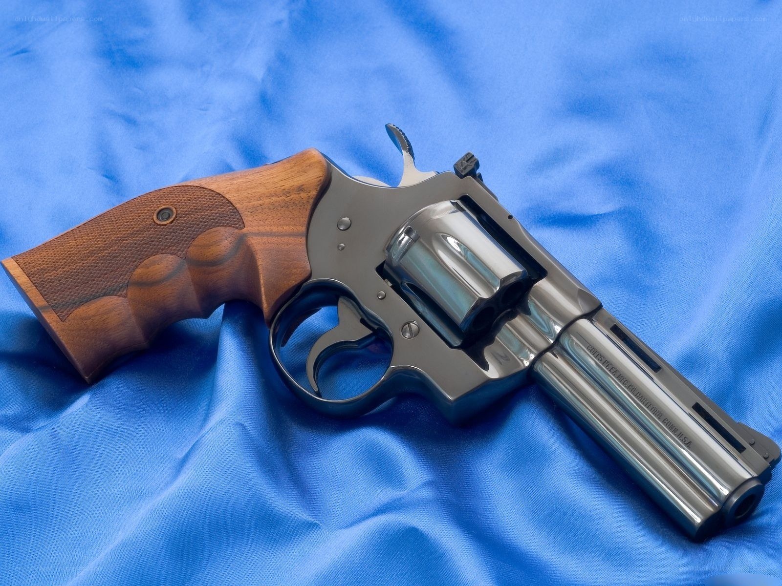 revolver on blue cloth
