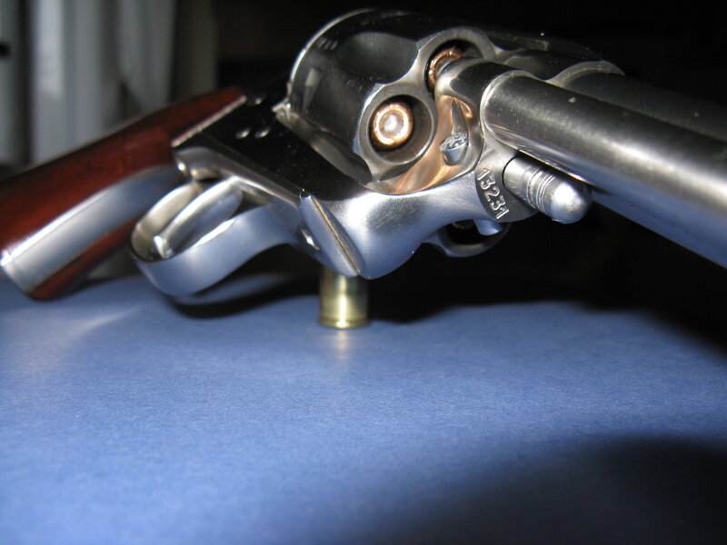 Revolver on Blue Surface