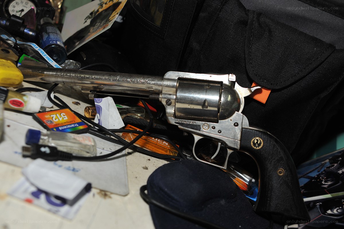 Revolver on cluttered desk