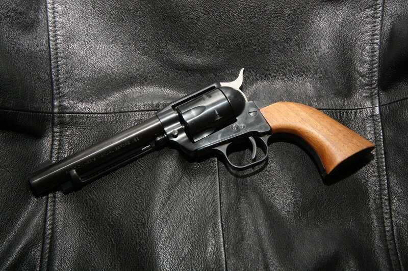 Revolver on Leather — Black, Neutral, Photograph