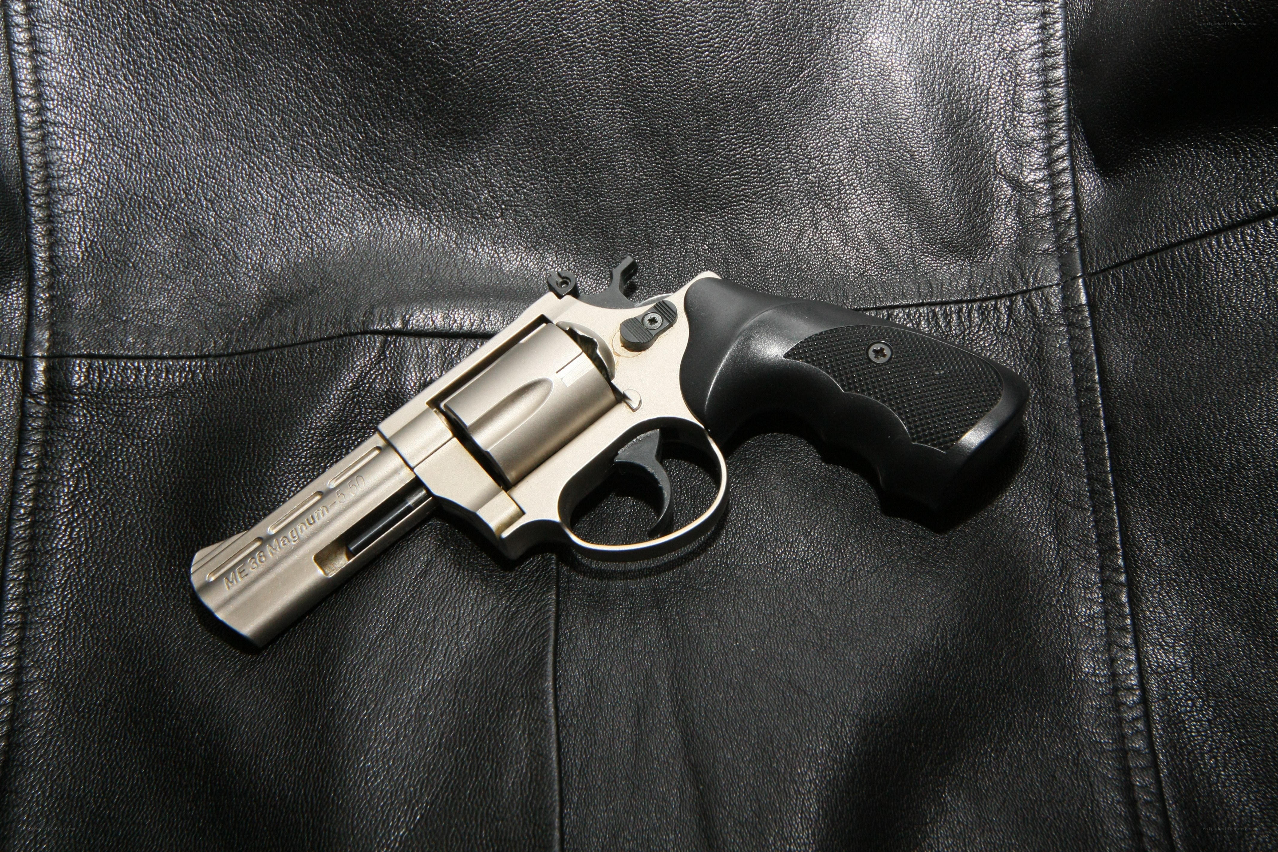 revolver on leather surface