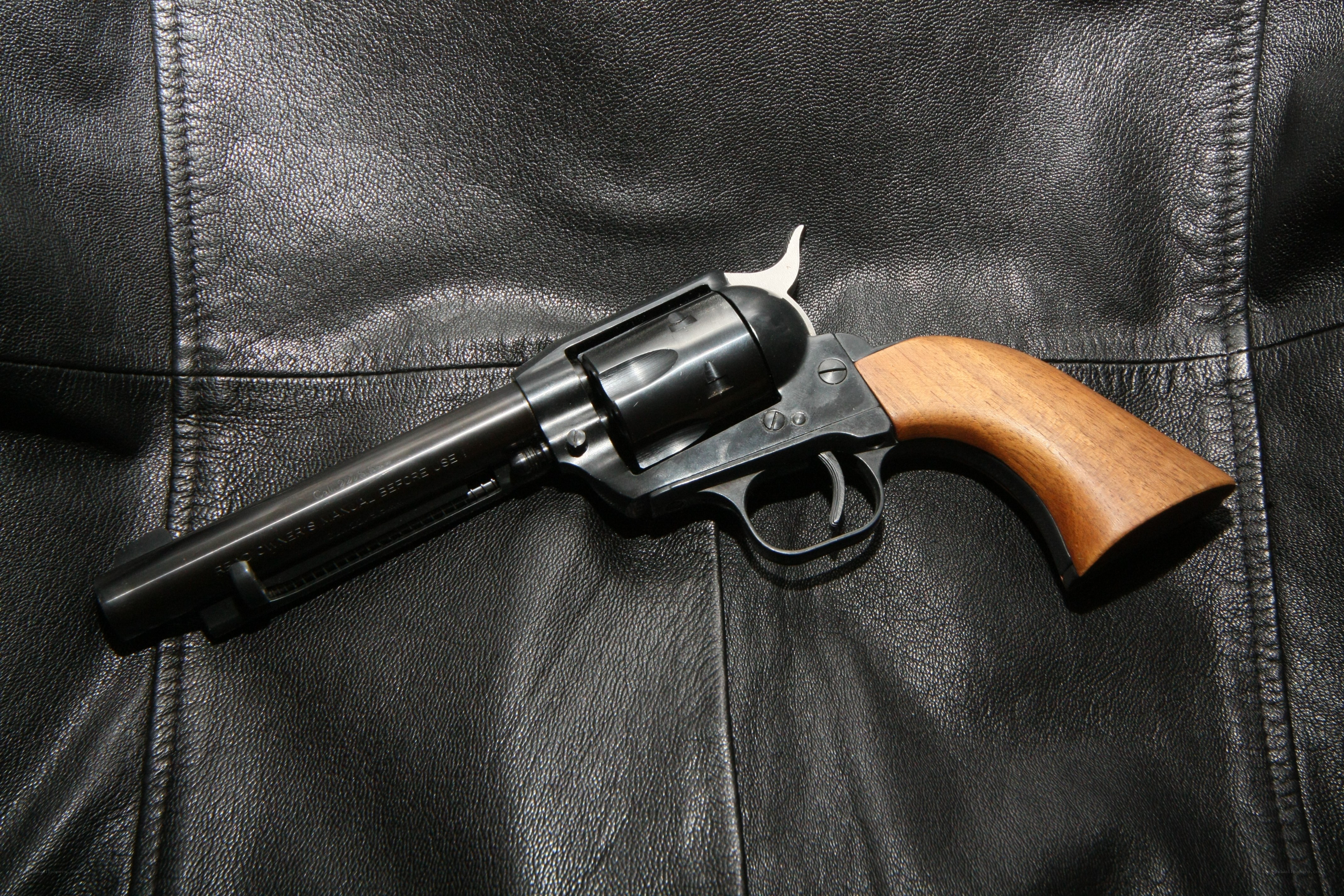 revolver on leather surface